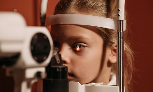Parent and child at an eye appointment